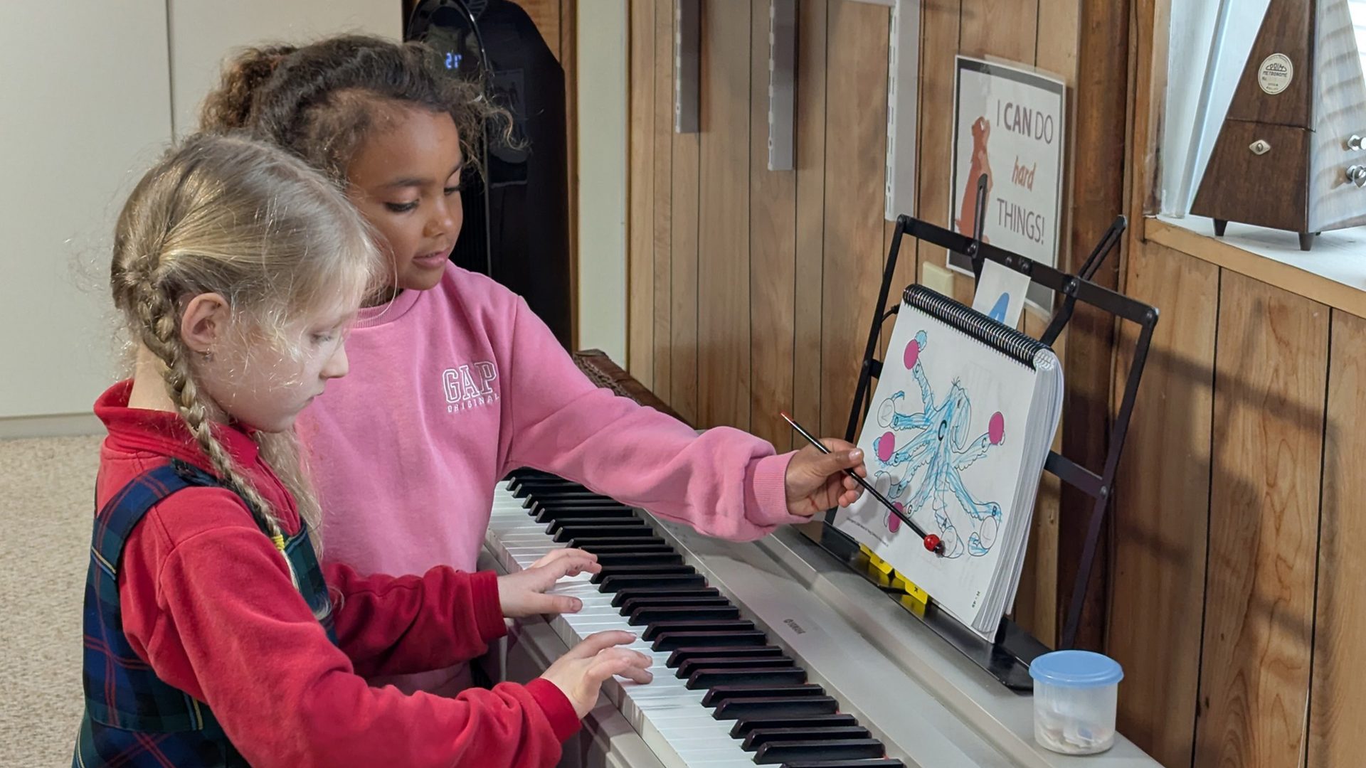 Children playing at piano